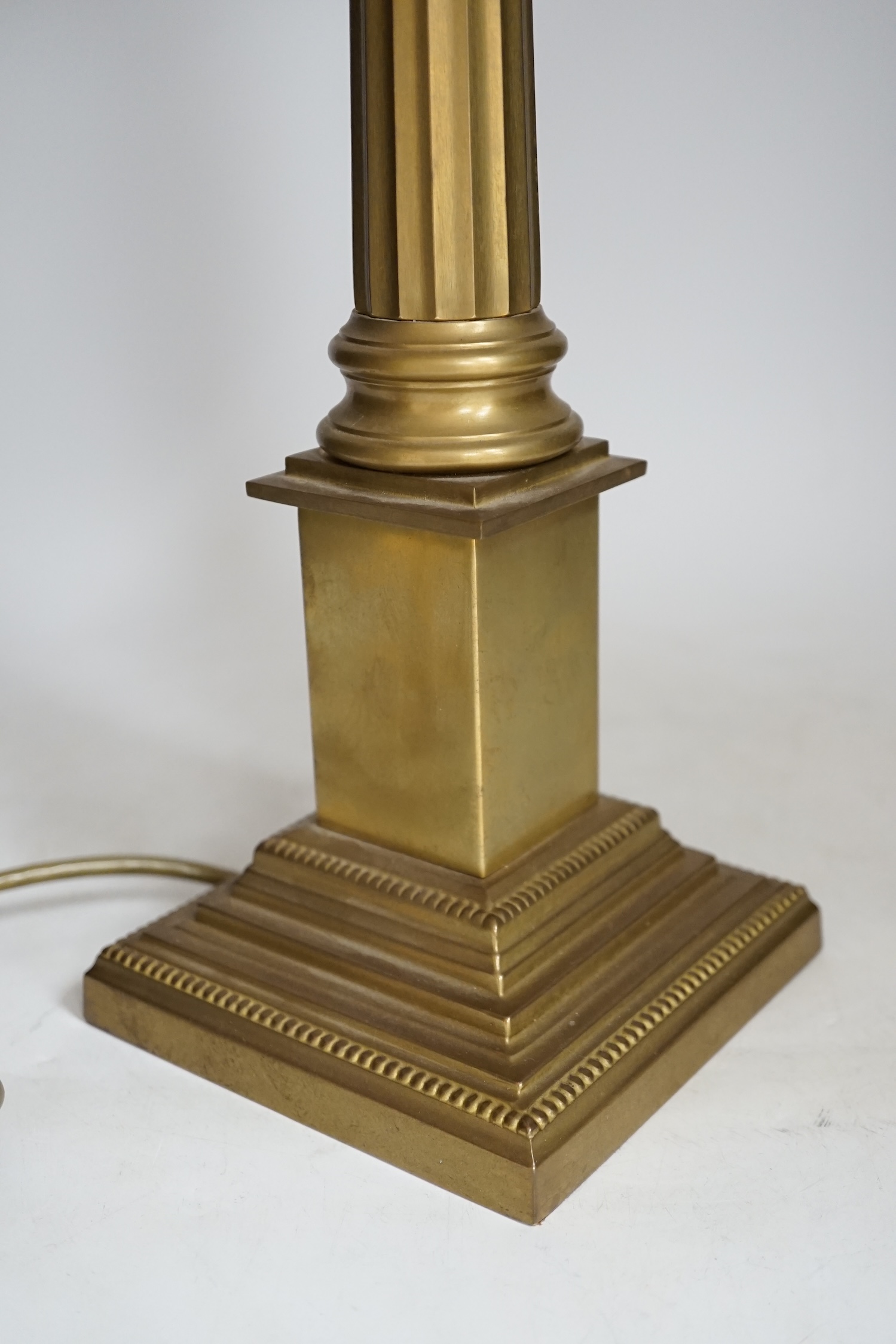 A brass column table lamp, 65cm high